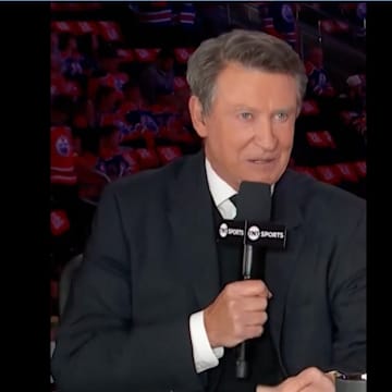Wayne Gretzky speaks at the desk during coverage of the 2025 Stanley Cup Final.