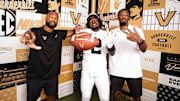 2026 RB Izayah Lee alongside Vanderbilt running backs coaches Ghaali Muhammad-Lankford (left) and Josh Adams (right)