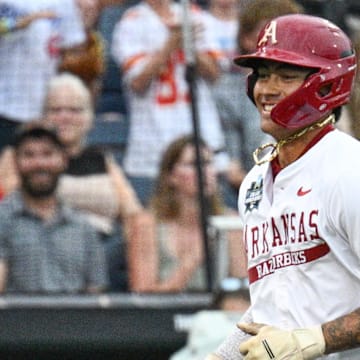 Arkansas Razorbacks shortstop Wehiwa Aloy (9) circles the bases after hitting a home run against the UCLA Bruins during the first inning at Charles Schwab Field. 