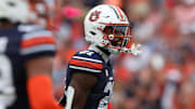 Auburn Tigers safety Caleb Wooden (21) reacts after tackling Oklahoma Sooners quarterback Michael Hawkins Jr. (9) during the third quarter at Jordan-Hare Stadium.