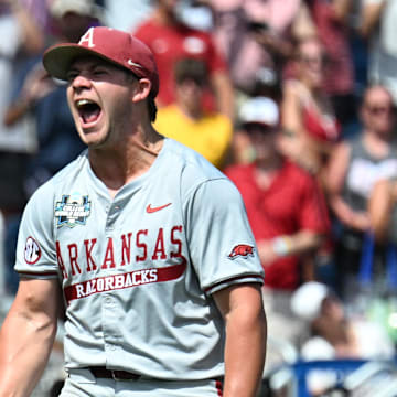 Arkansas Razorbacks starting pitcher Gage Wood celebrates completing a no-hitter at the College World Series.