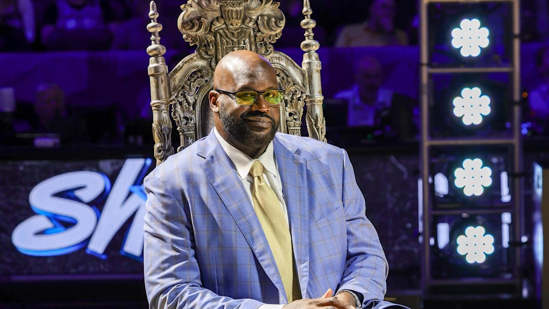 Shaq smiles during a ceremony to retire his #32 jersey at Orlando's Amway Center.
