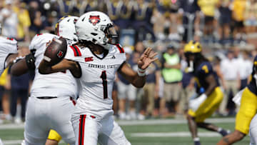 Sep 14, 2024; Ann Arbor, Michigan, USA;  Arkansas State Red Wolves quarterback Jaylen Raynor (1) throws against the Michigan Wolverines during the first half at Michigan Stadium. Mandatory Credit: Rick Osentoski-Imagn Images