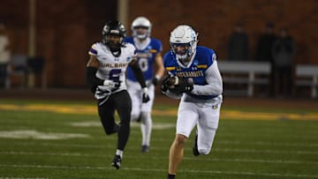 SDSU's safety Tucker Large (1) runs with the ball during the second quarter while playing against University of Albany on Friday, Dec. 15, 2023 at Dana J. Dykhouse in Brookings.