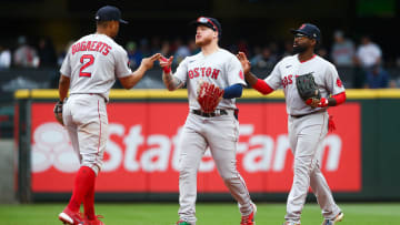 Jun 12, 2022; Seattle, Washington, USA;  Boston Red Sox shortstop Xander Bogaerts (2) celebrates a 2-0 win over the Seattle Mariners with left fielder Alex Verdugo (99) and center fielder Jackie Bradley Jr. (19) at T-Mobile Park. Mandatory Credit: Lindsey Wasson-USA TODAY Sports