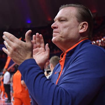 Nov 13, 2024; Champaign, Illinois, USA;  Illinois Fighting Illini head coach Brad Underwood applauds the crowd before a against the Oakland Golden Grizzlies at State Farm Center. Mandatory Credit: Ron Johnson-Imagn Images