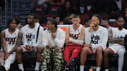 Apr 28, 2025; Miami, Florida, USA; Miami Heat guard Tyler Herro (center) looks on from the bench against the Cleveland Cavaliers in the fourth quarter during game four for the first round of the 2025 NBA Playoffs at Kaseya Center. Mandatory Credit: Sam Navarro-Imagn Images