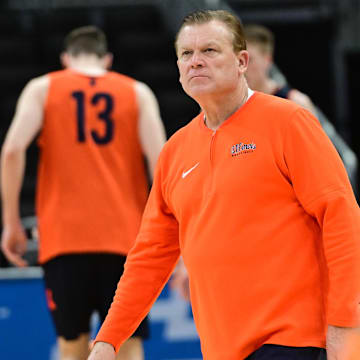 Mar 20, 2025; Milwaukee, WI, USA;  Illinois Fighting Illini head coach Brad Underwood watches during NCAA Tournament First Round Practiceat Fiserv Forum. Mandatory Credit: Benny Sieu-Imagn Images