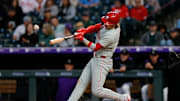 May 20, 2025; Denver, Colorado, USA; Philadelphia Phillies second baseman Bryson Stott (5) hits a single in the sixth inning against the Colorado Rockies at Coors Field. 
