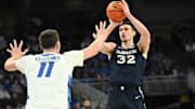 Jan 29, 2025; Omaha, Nebraska, USA;  Xavier Musketeers forward Zach Freemantle (32) shoots over Creighton Bluejays center Ryan Kalkbrenner (11) during the first half at CHI Health Center Omaha. Mandatory Credit: Steven Branscombe-Imagn Images