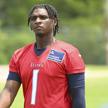 Tennessee Titans quarterback Cam Ward (1) walks off the field during minicamp.