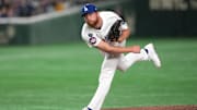 Mar 16, 2025; Bunkyo, Tokyo, Japan; Los Angeles Dodgers pitcher Matt Sauer (64) throws a pitch against the Hanshin Tigers during the fifth inning at Tokyo Dome. Mandatory Credit: Darren Yamashita-Imagn Images